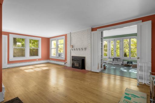 Inviting living room/ dining room with fireplace