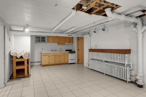 Lower level family room has a wet bar/ kitchenette