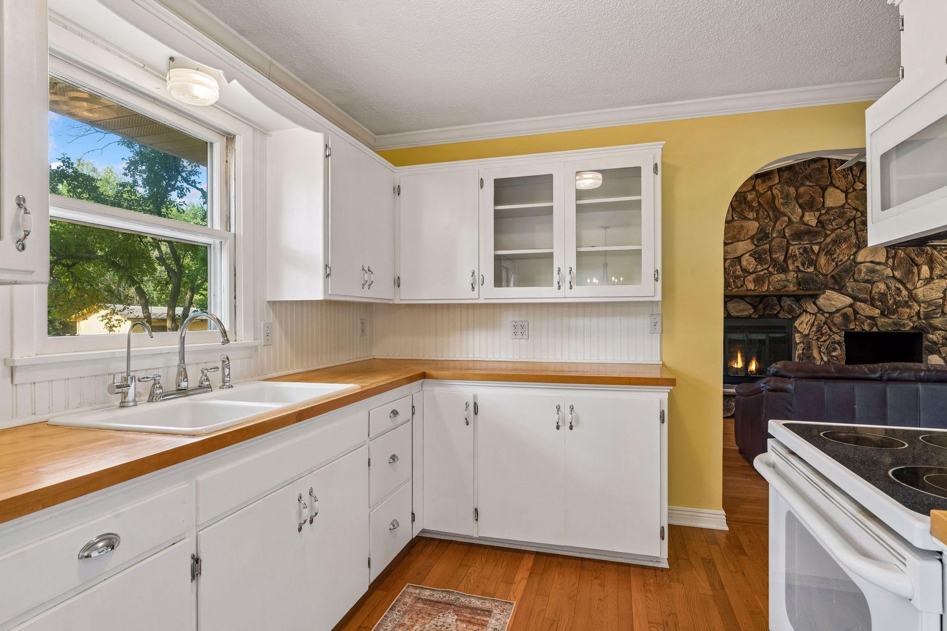 Kitchen window overlooks the large backyard