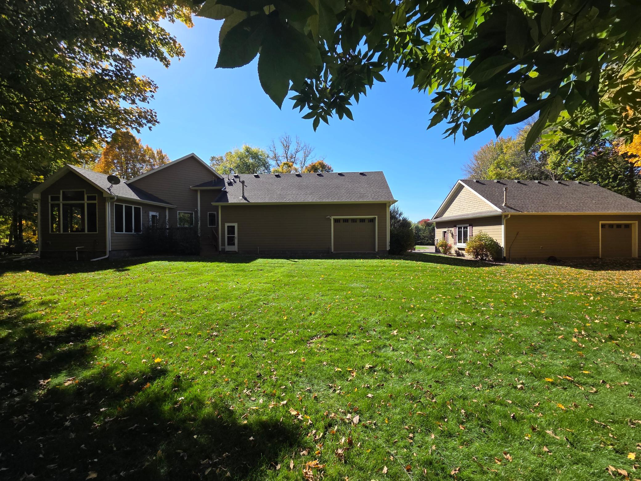 Back of home w/ garage overhead doors on each.jpg