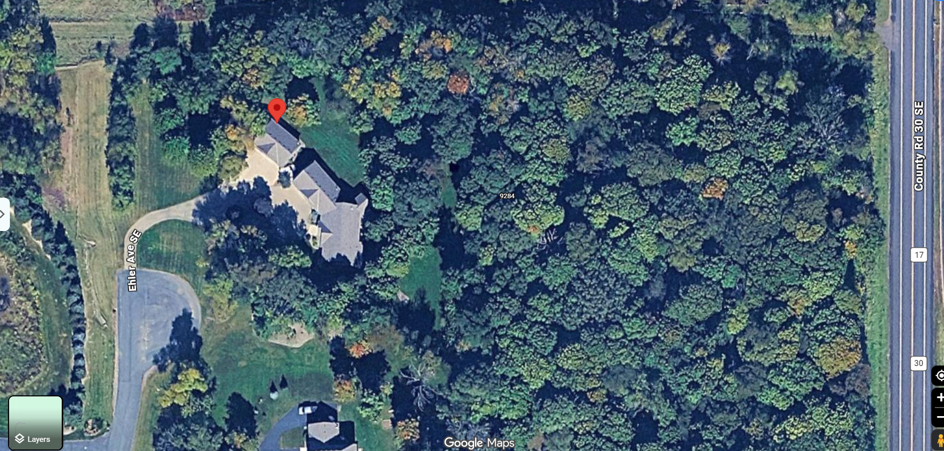 aerial view of home + 2 garages
