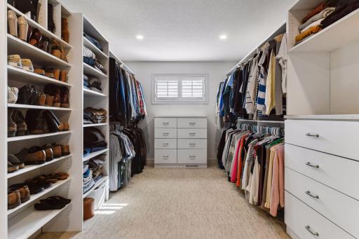 Primary suite closet with natural daylight