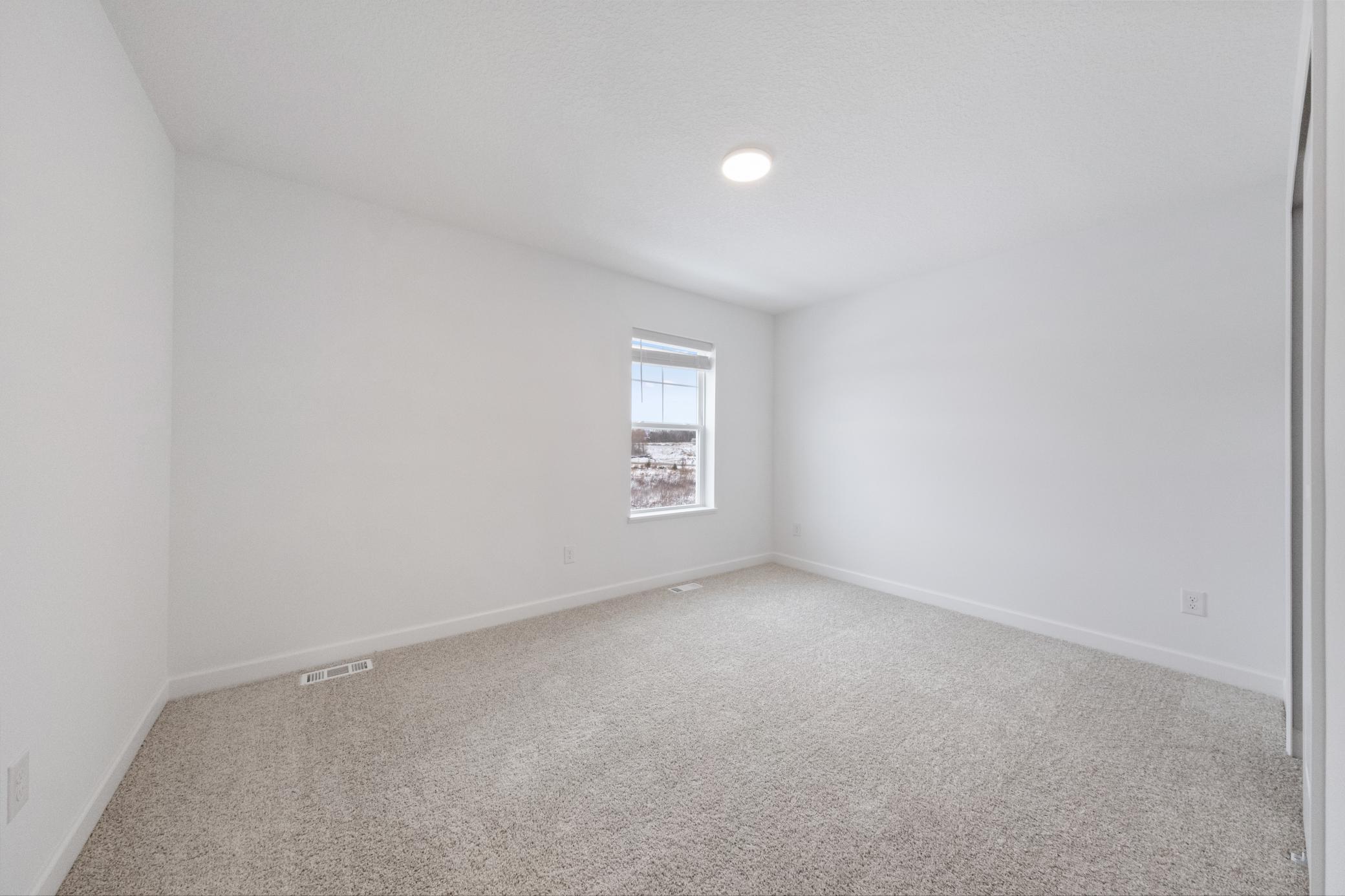 (Photo of an inventory home, actual homes finishes will vary) Secondary bedroom