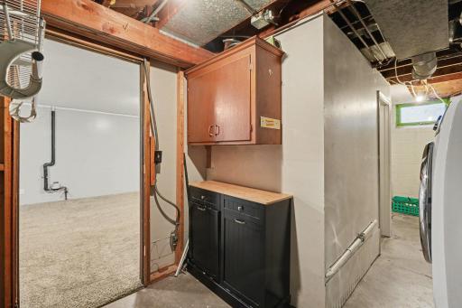 Utility / storage area + laundry and LL bathroom