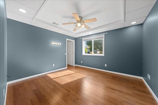 This lower level bedroom features extra ceiling lighting which would be great for an office or craft/sewing room!