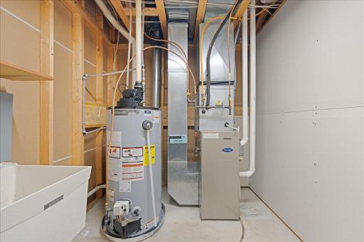 Lower level furnace area with bonus wash sink.