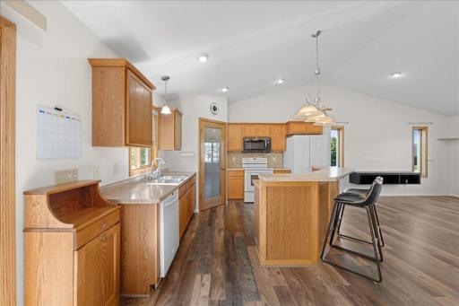 The kitchen features a center island with additional storage.