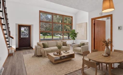 Main level: huge faulted ceilings with large windows (virtually staged)