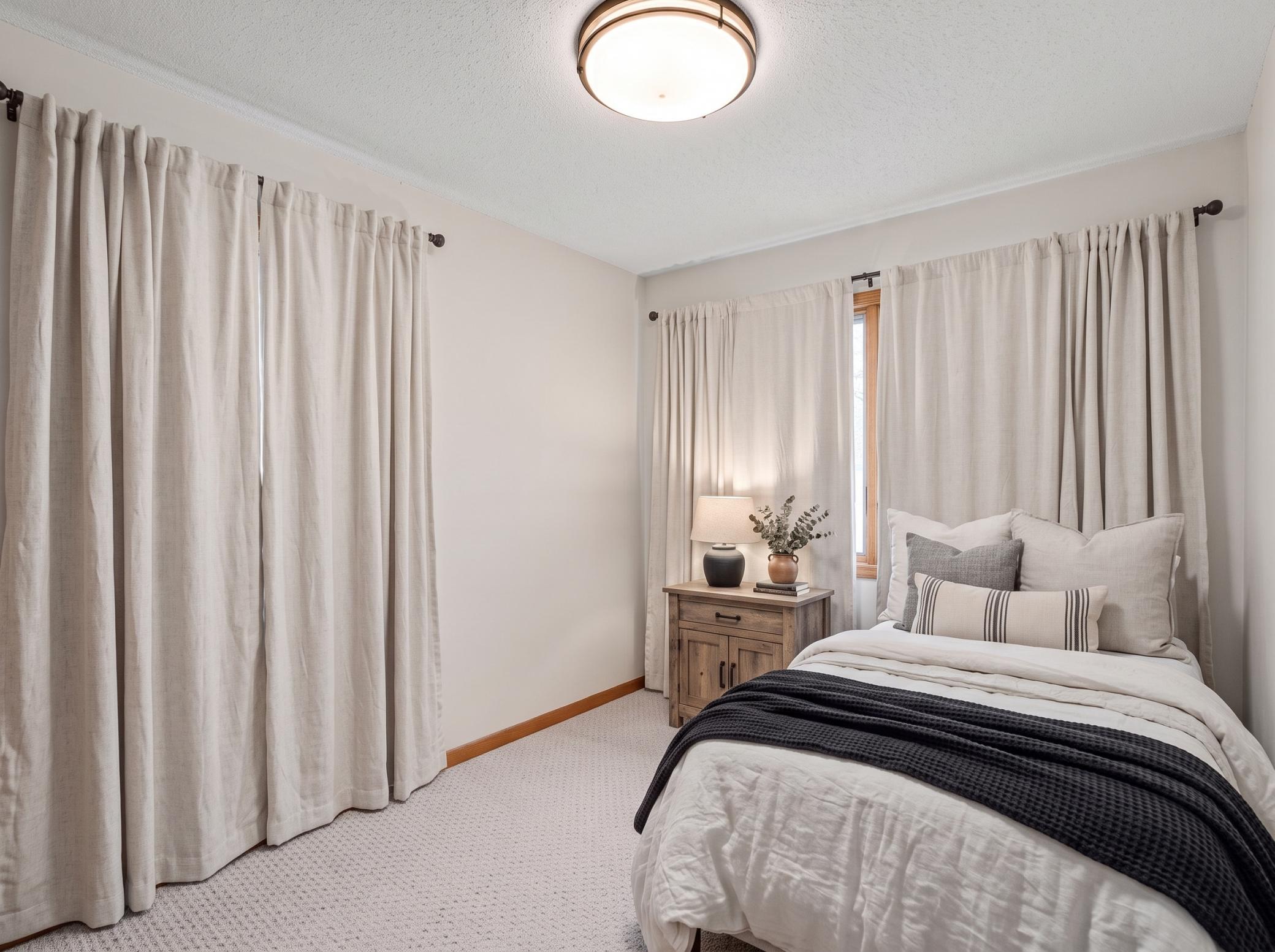 Main level: bedroom 1 (virtually staged)