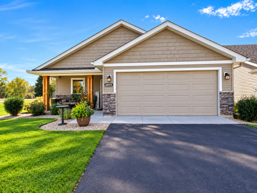Beautiful detached townhome with main level living on corner lot!