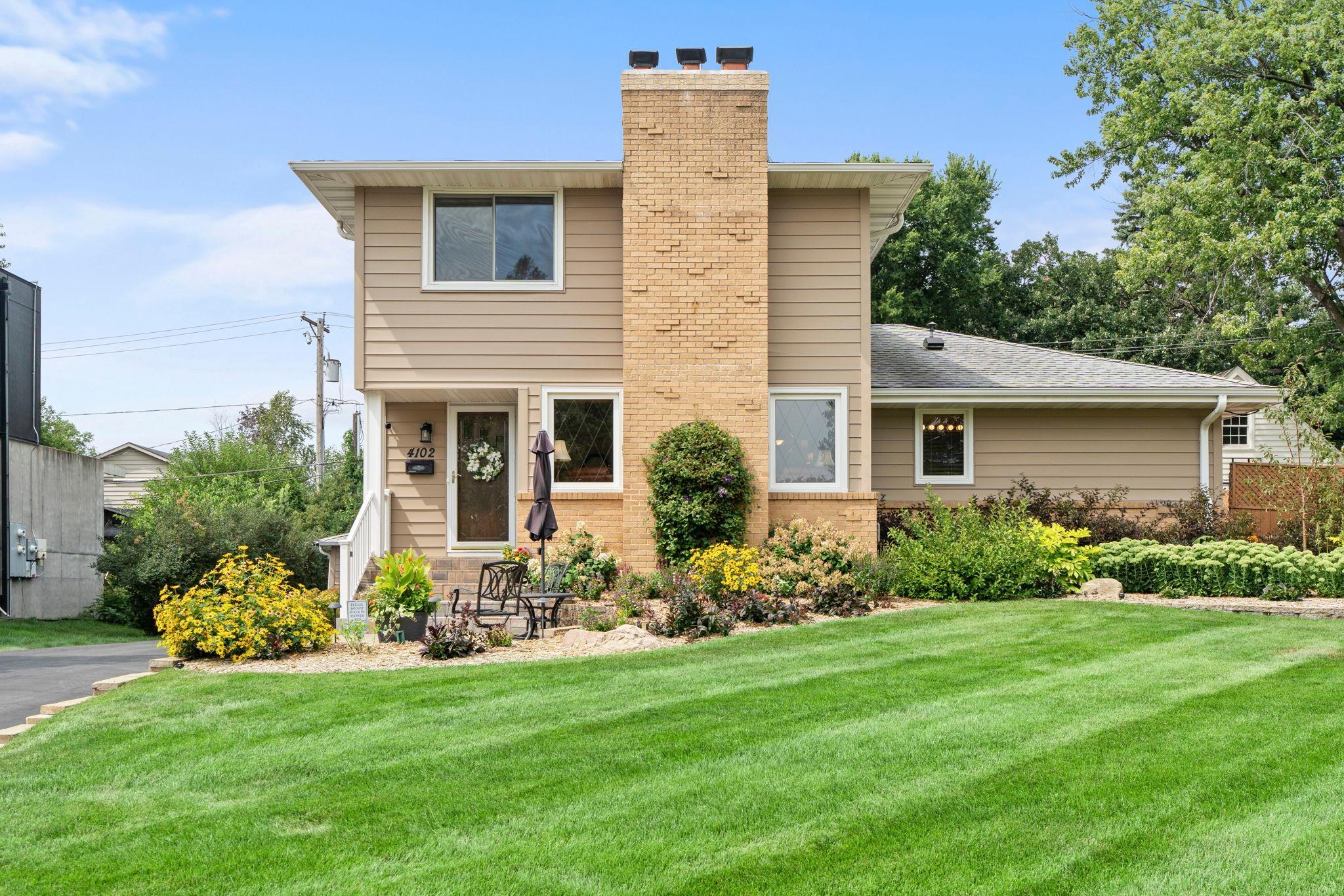 A pristine, sprawling front lawn and inviting entry set the tone for this beautifully maintained Morningside home.