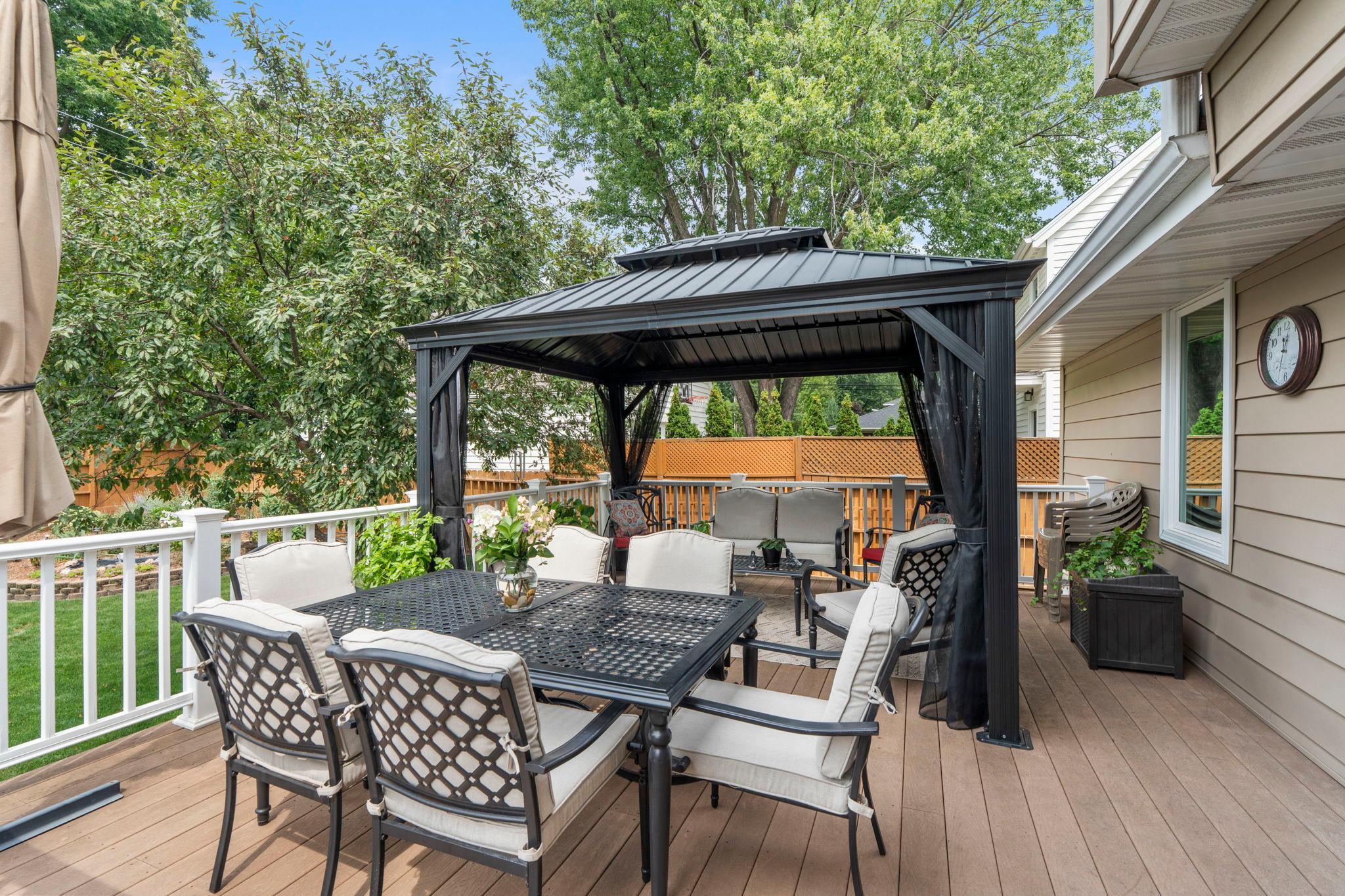 The composite deck's gazebo sitting area is the perfect spot for outdoor dining and relaxing.