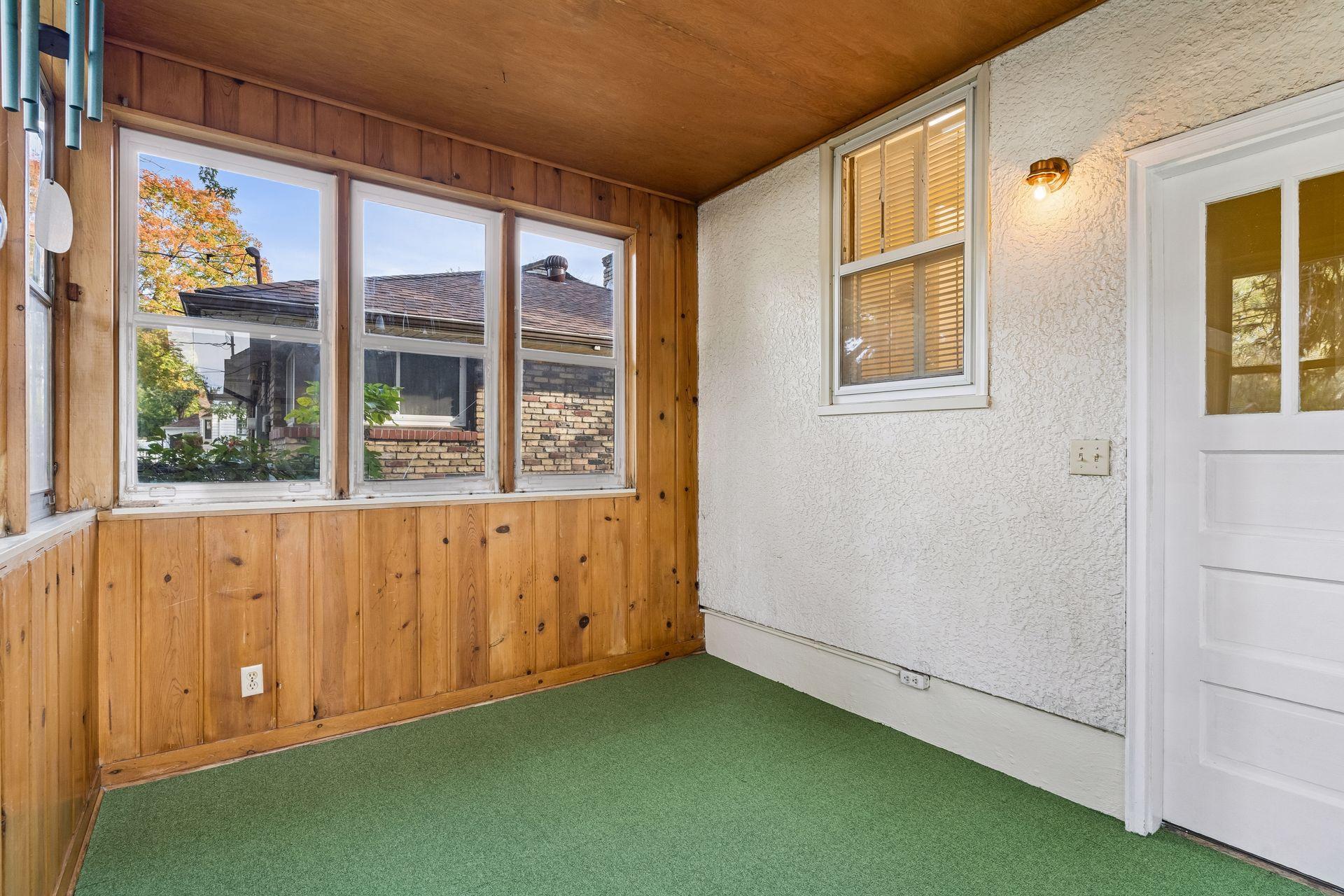 The three-season porch is just off the landing between the kitchen and the basement stairs.