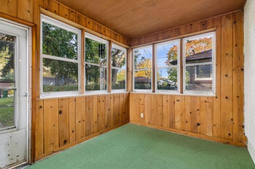 Take a look at the inviting three-season porch with storm windows and brand-new carpet.