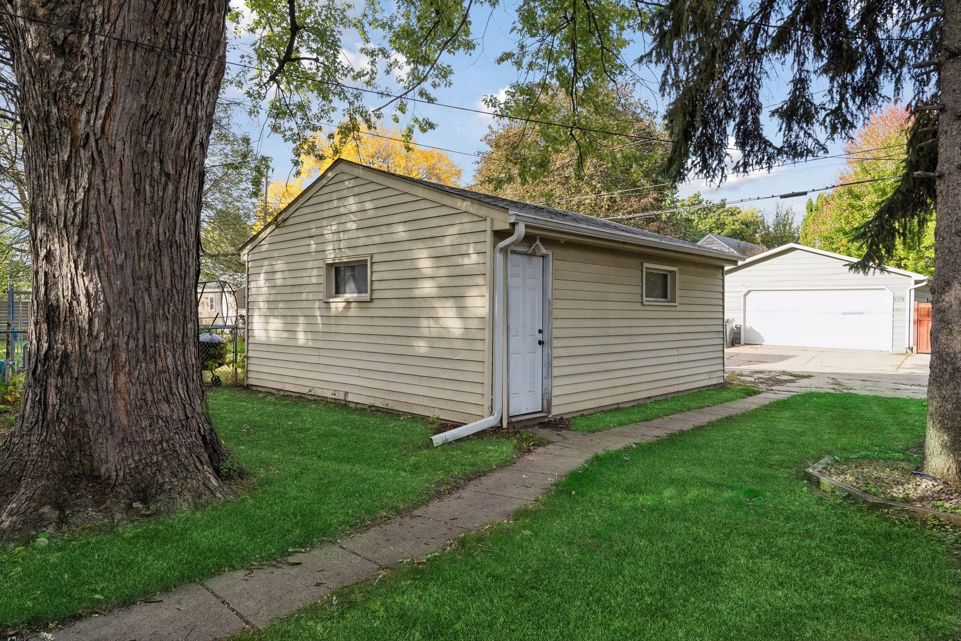 The detached two-car garage is plenty big with a 10-year old roof.