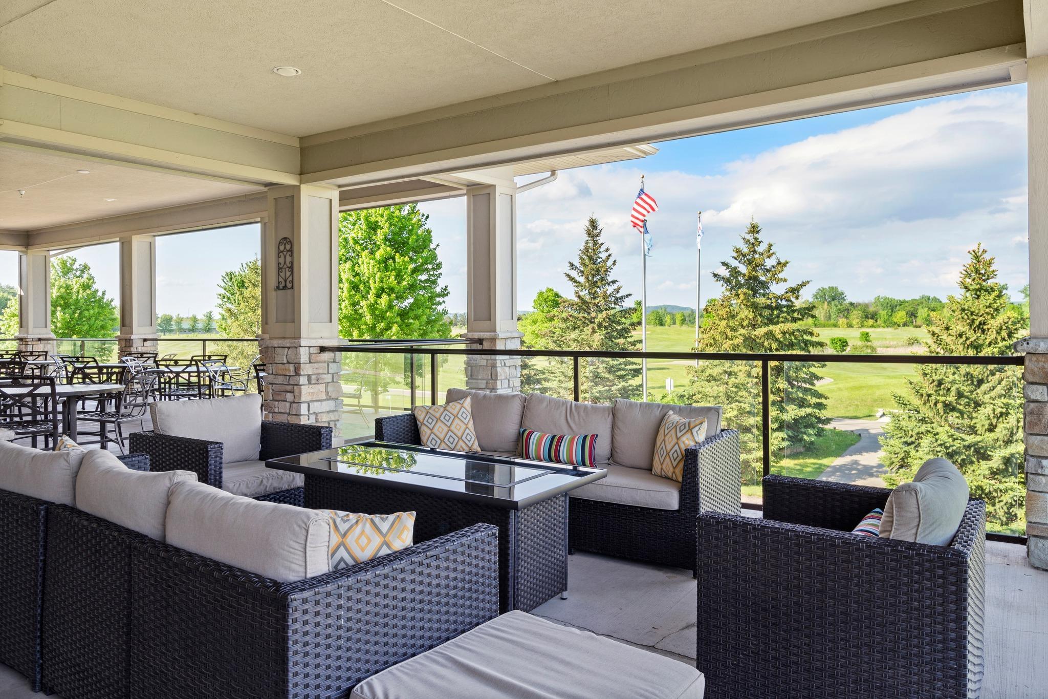 Indoor seating, a covered terrace, and patio dining offer panoramic views of the golf course and the Mississippi River Bluffs. (Photo courtesy of The Jewel Golf Club)