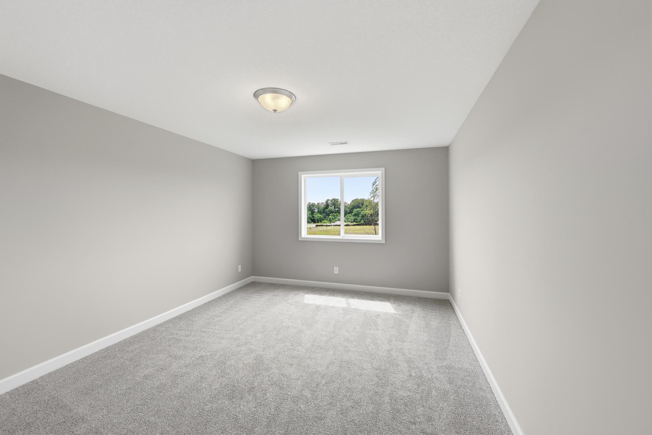 Finished Walkout Basement Bedroom 4 - The Madison at 937 Kepler Ave NE in Oakview Ridge!