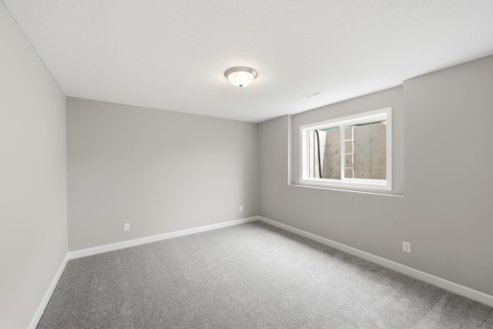 Finished Walkout Basement Bedroom 5 - The Madison at 937 Kepler Ave NE in Oakview Ridge!