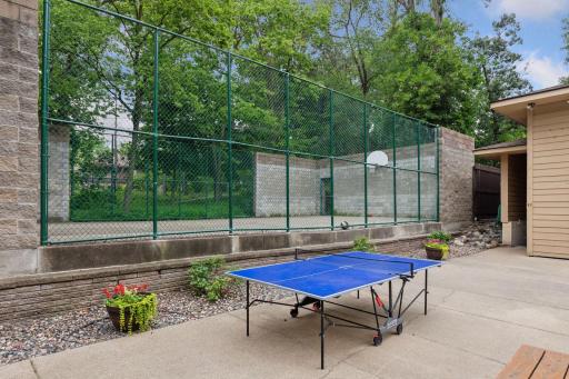 Enjoy community amenities including a basketball court and outdoor ping-pong table.