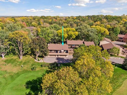 Quiet cul-de-sac setting with mature trees, a spacious deck and golf course views.