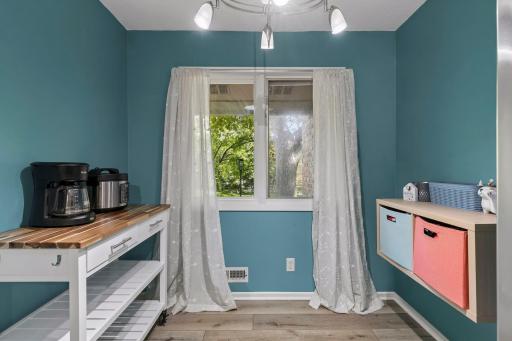 Versatile kitchen nook offers space for extra storage or an informal dining table.