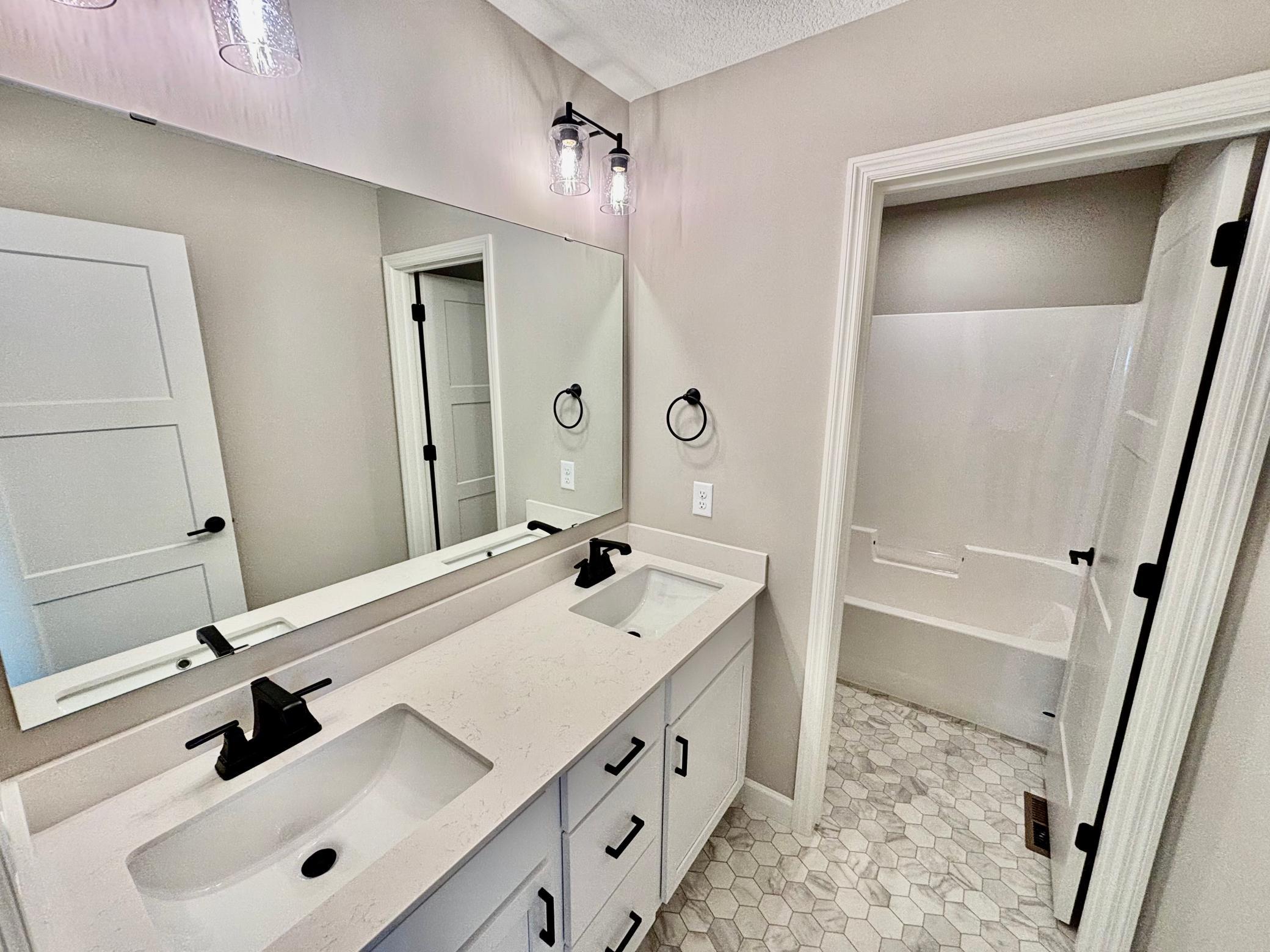 Upper Level Full Bath - The Summit at 941 Kepler Ave NE in Oakview Ridge!