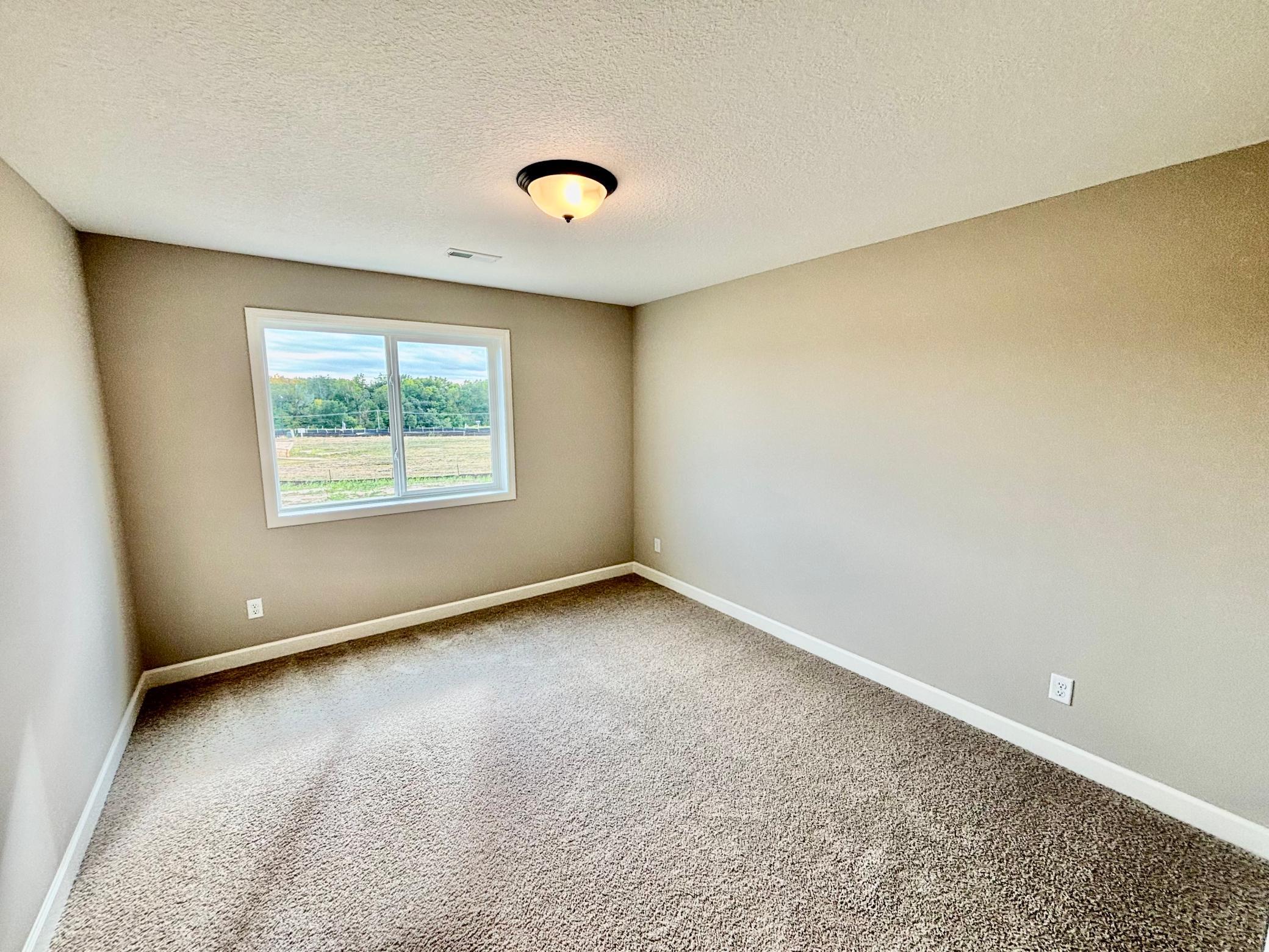 Finished Walkout Basement Bedroom 5 - The Summit at 941 Kepler Ave NE in Oakview Ridge!