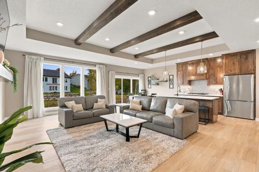 Family Room w/ wood ceiling beams & beautiful custom fireplace