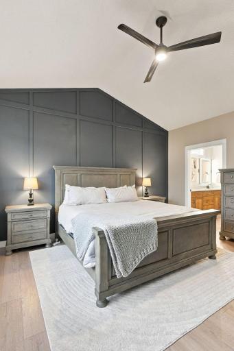 Vaulted Primary Suite w/ luxury Private Bath, floor-to-ceiling tiled shower & oversized WIC w/ direct Laundry Room access