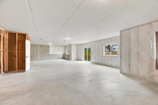 Unfinished walkout Lower Level w/ 9' ceilings, bath rough-in & incredible potential for future living space
