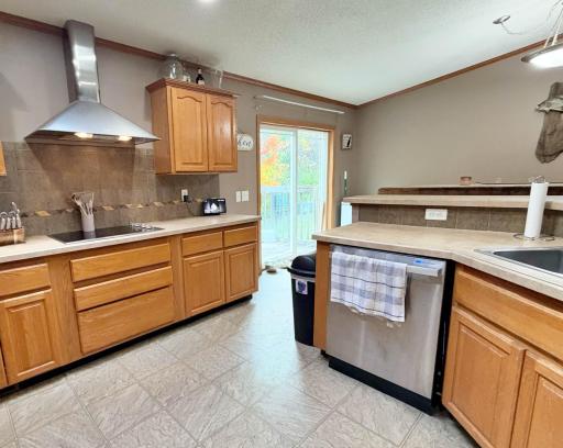 Kitchen into dining area with sliding door to deck.jpg