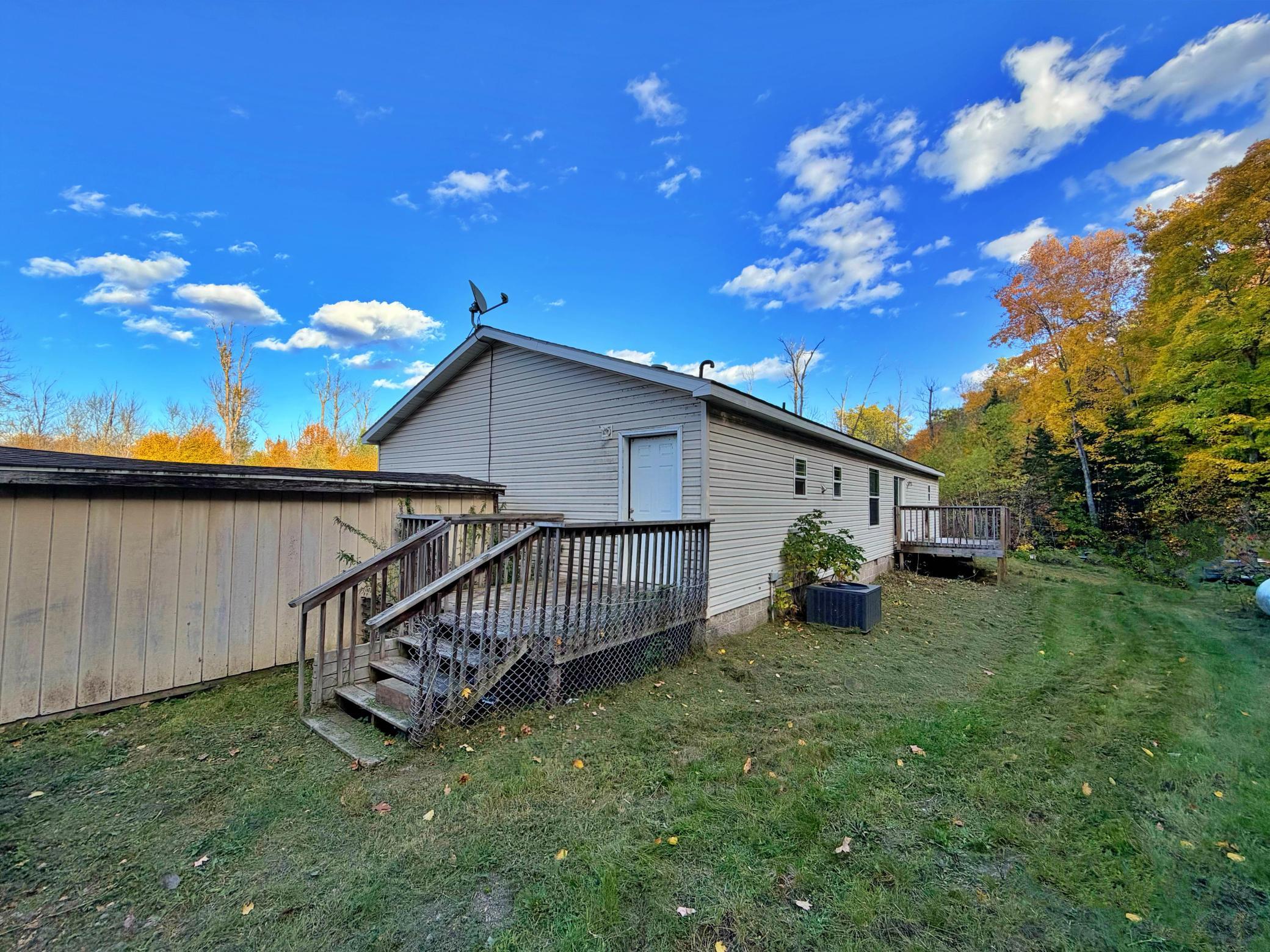 Back yard view of home with deck and shed.jpg