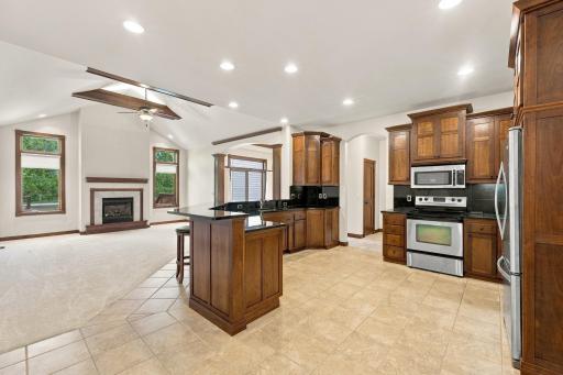 Large, open-concept kitchen with access to living and dining room
