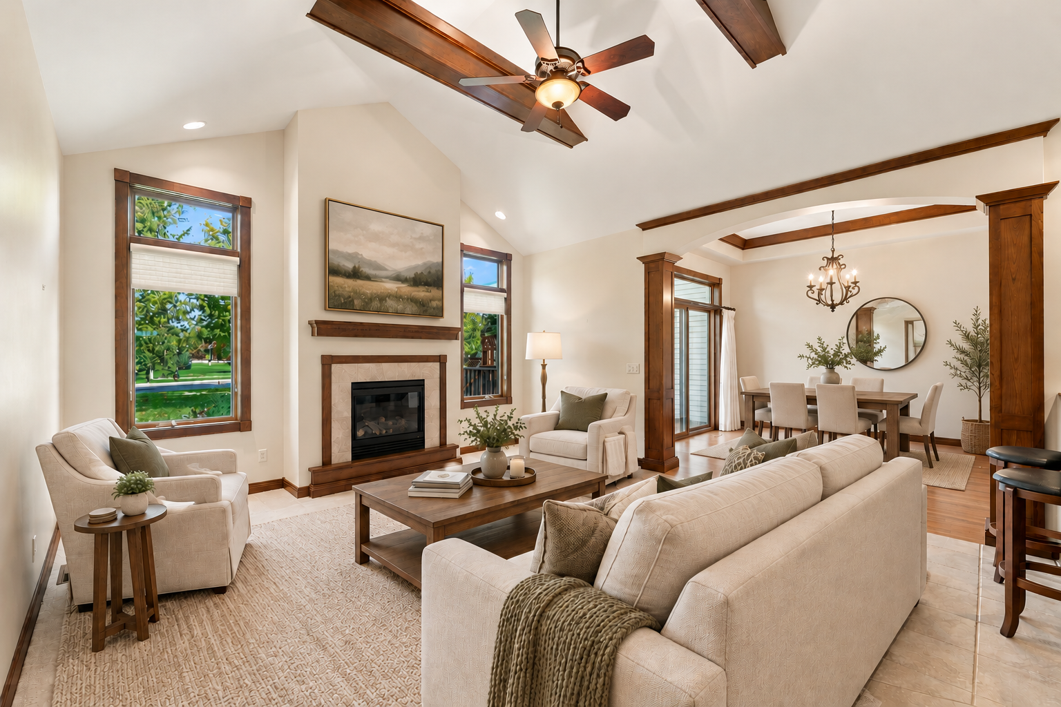 Living Room with deep vaulted ceiling, gas fireplace and dining area - Virtually Staged