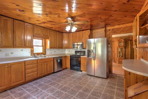 leading to a modern kitchen with stainless steel appliances