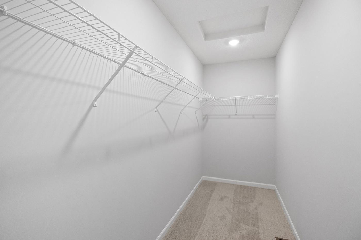 Owner's Walk-in Closet (Photo of a similar home - Colors and selections will vary)