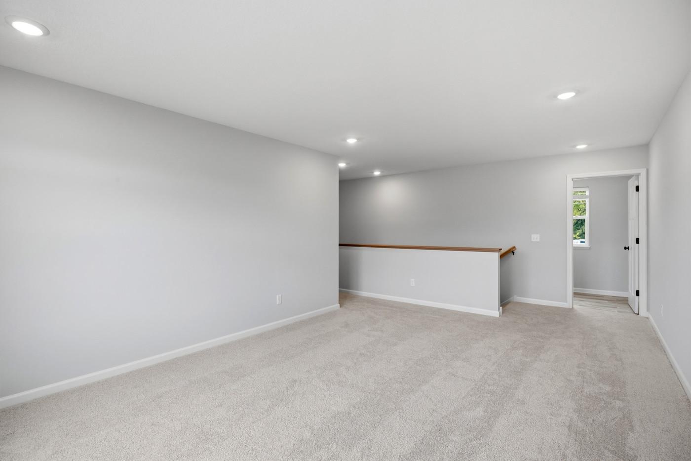 Loft is nicely separated from the 4 bedrooms. (Photo of a similar home - Colors and selections will vary)
