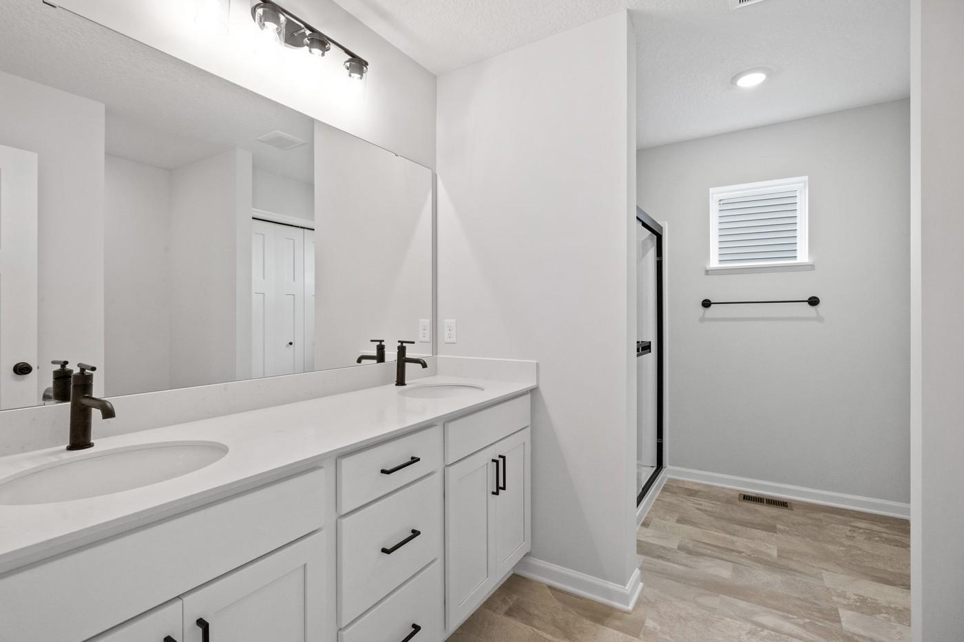 It's the little daily luxuries in life, like dual sinks, a large linen closet, and plenty of cabinet space. (Photo of a similar home - Colors and selections will vary)