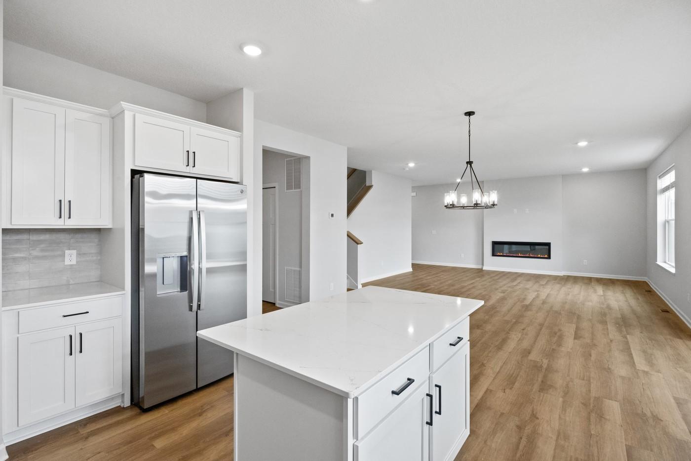 Open concept kitchen, dining, and family room (Photo of a similar home - Colors and selections will vary)