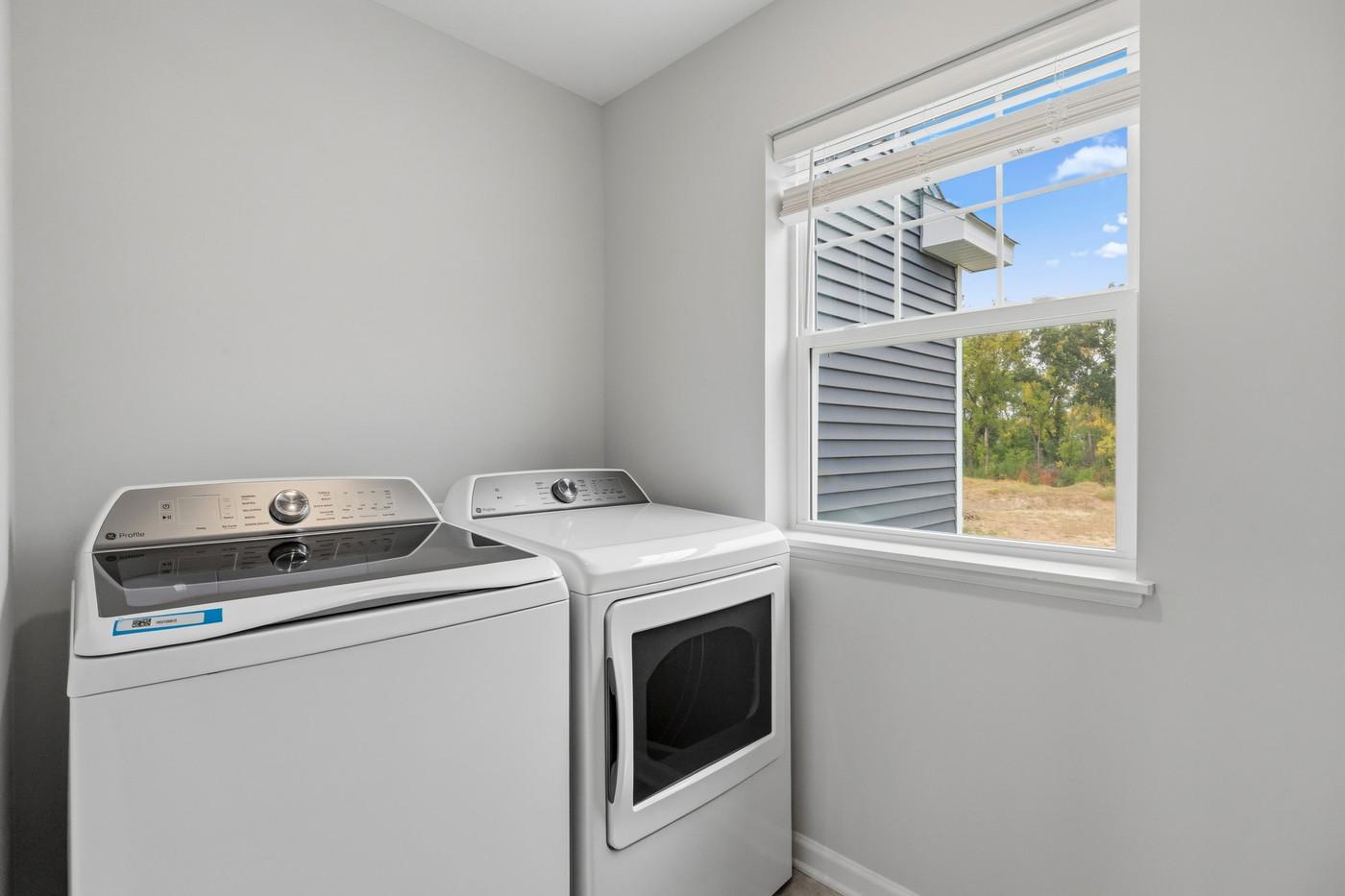 Convenient upper level laundry - Washer and dryer are included. (Photo of a similar home - Colors and selections will vary)