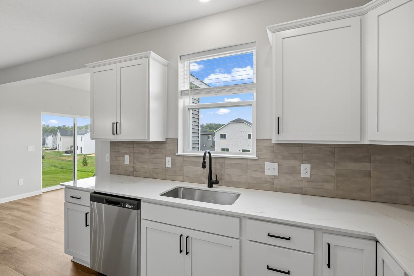 Kitchen window with view of your backyard. (Photo of similar home - Colors and selections will vary)