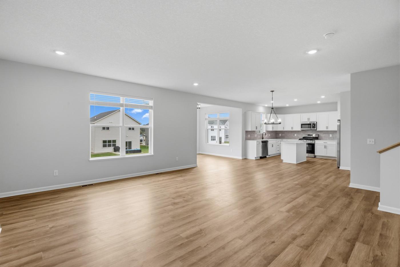 View of the open concept space and morning room. (Photo of a similar home - Colors and selections will vary)