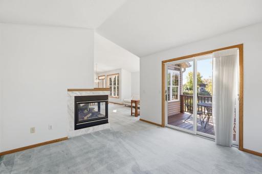 Sunroom has the advantage of the fireplace and walkout to the deck.