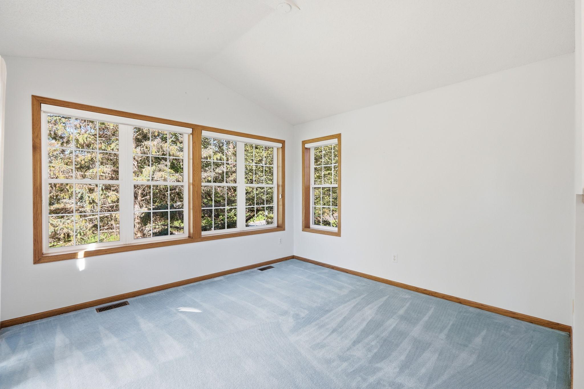 Sunroom has vaults and great west and south windows with views of pond.