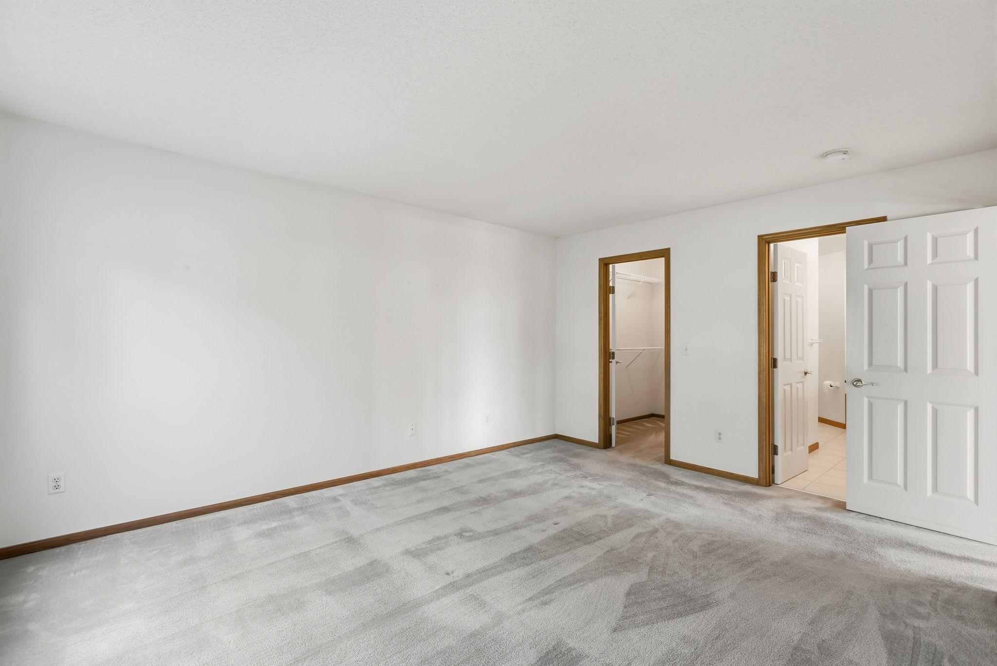 Primary has ensuite bath and walk-in closet.