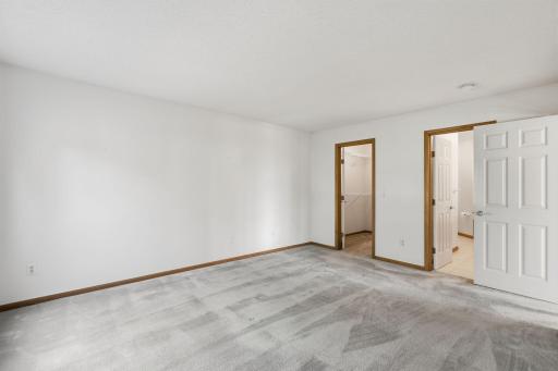 Primary has ensuite bath and walk-in closet.