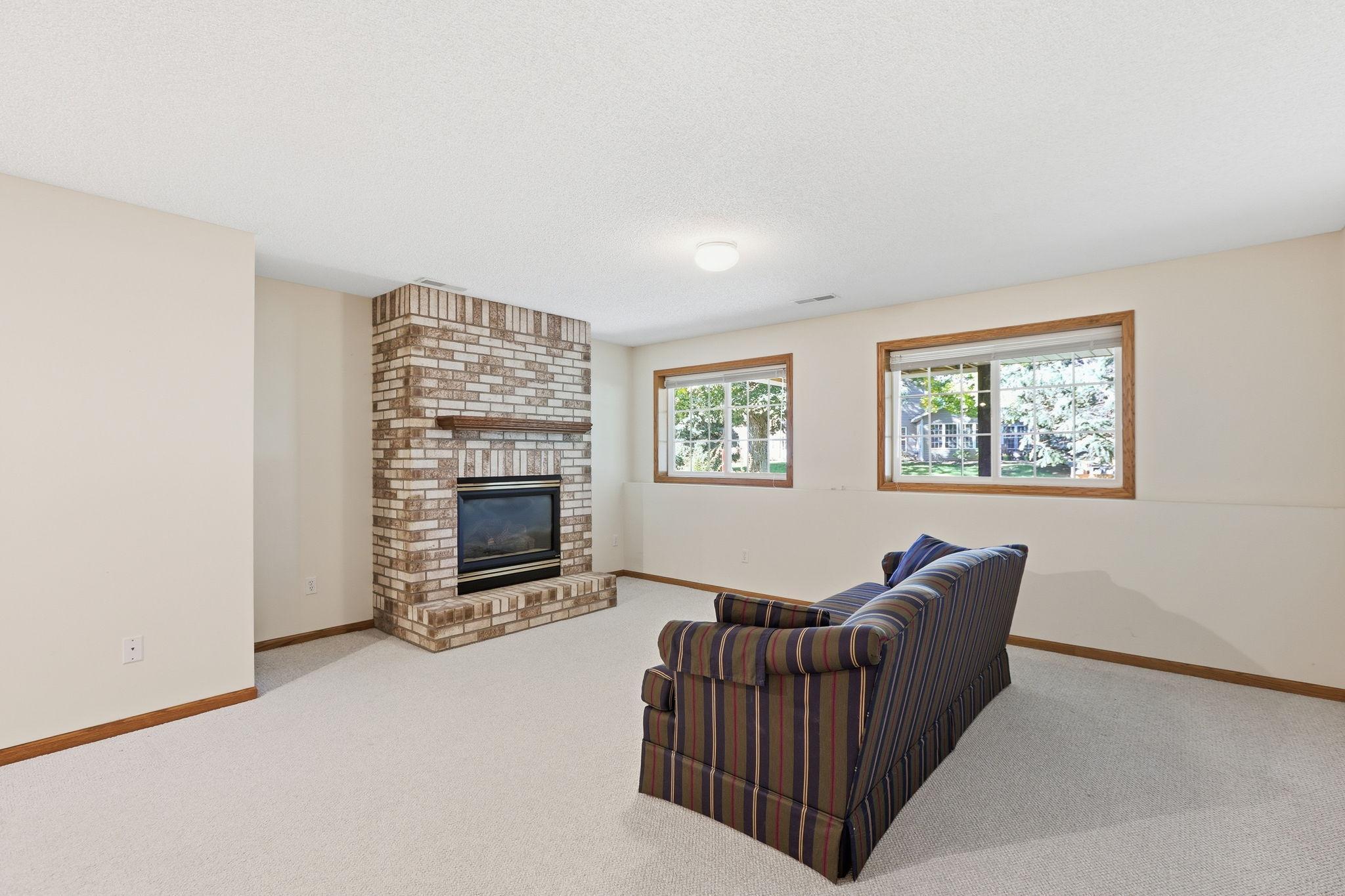Lower level family room with gas fireplace.