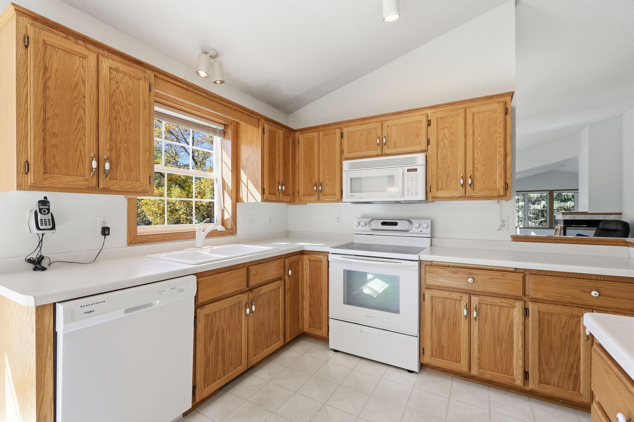 Great amount of countertops in the vaulted kitchen.