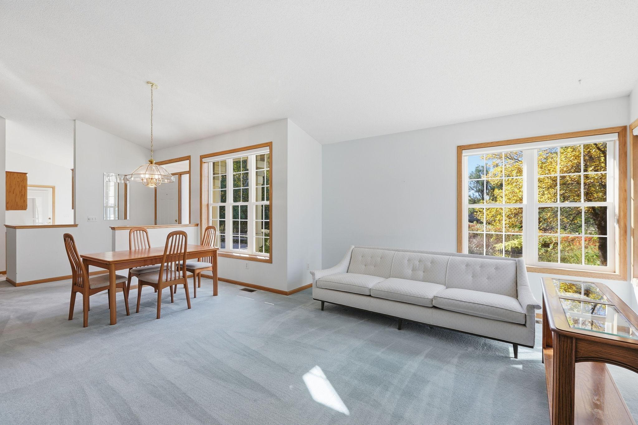 Open entry into Vaulted living area with Dining and Living room.