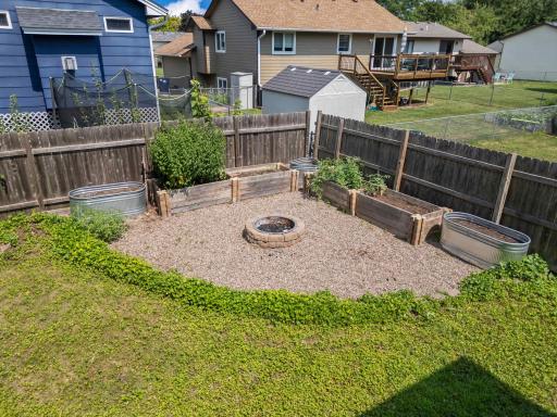 back yard with fire pit and garden boxes.jpg